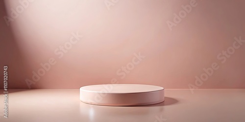 A minimalist pink cylindrical pedestal on a pale pink surface against a smooth wall, ideal for product display or presentation