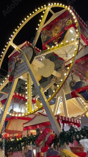 A vibrant Christmas market featuring a glowing ferris wheel, festive lights, and decorated stalls, creating a cheerful holiday ambiance.
