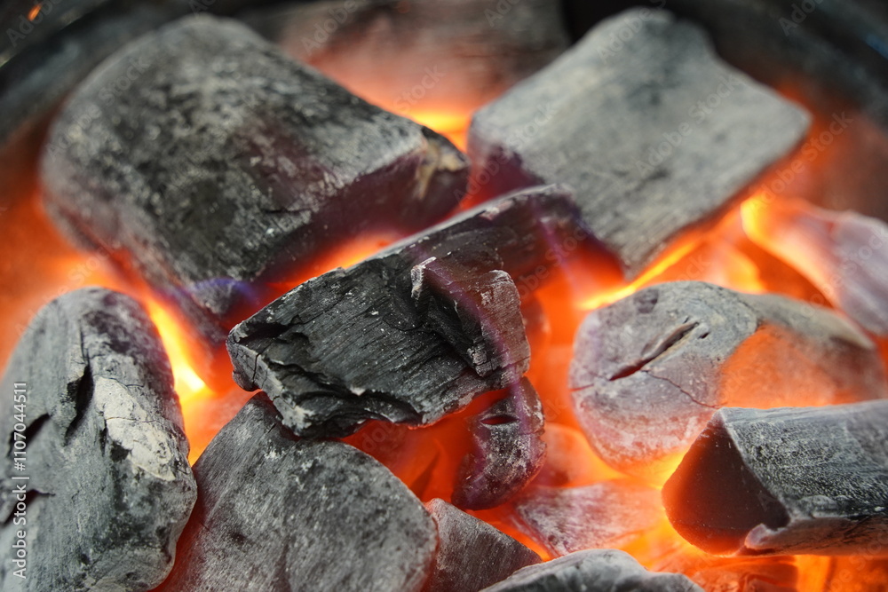Burning charcoal in a brazier, closeup of photo Burning charcoal in a brazier, closeup of photo