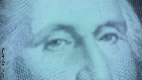 Portrait of the first US President George Washington, US President George Washington on USA one dollar bill,the camera zooms in on the eyes until they become clear in focus
