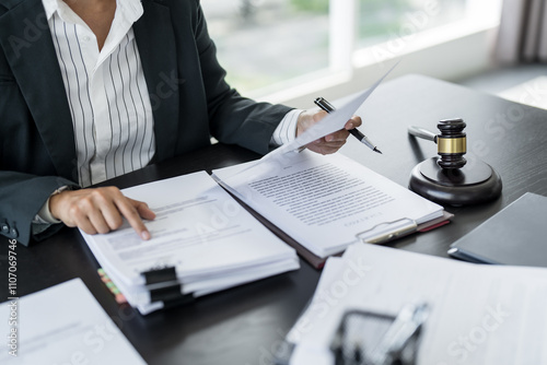Quadro em tela Lawyer businessman working with lawbook in office or courtroom Legal counsel with gavel and legal law