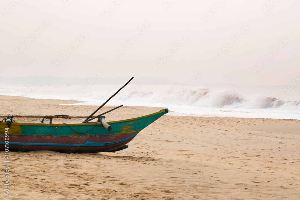 Naklejka premium Colorful beautiful boat moored on the beach