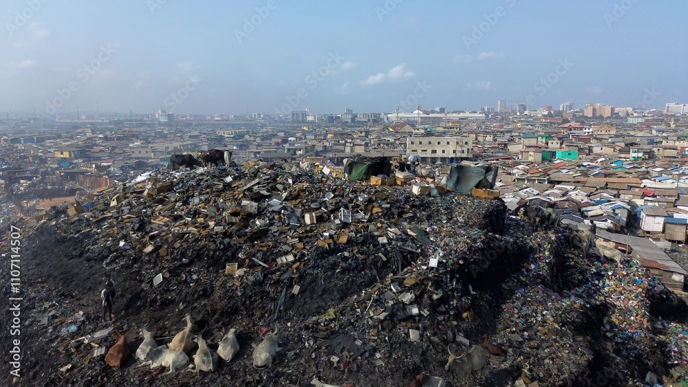 Obraz premium Ghana, Accra, 10,18,24 AGBOGBLOSHIE people live in slum largest landfill illegal dump in Africa for electronic and plastic waste. Odaw River High environmental toxic pollution area, climate change