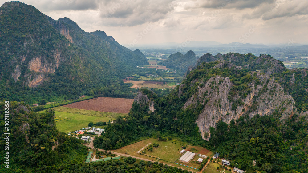 Aerial of Ban Chai Khao limestone mountains in Thailand Uthai Thani province , drone fly above famous Thai-Switzerland Aerial of Ban Chai Khao limestone mountains in Thailand Uthai Thani province , drone fly above famous Thai-Switzerland
