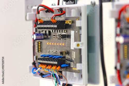 Security and fire alarm equipment with LEDs on. Close-up. Soft focus.