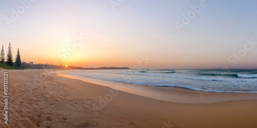 A serene beach sunset with golden sand, gentle waves, and the sun dipping below the horizon. The sky is painted in soft pinks and oranges, creating a tranquil and romantic vibe.