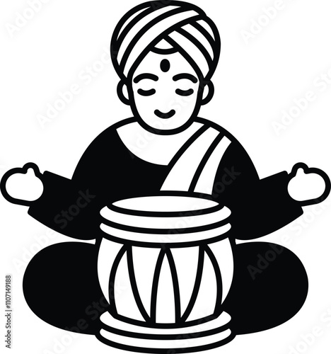 A man in a robe is sitting cross legged with a drum in front of him