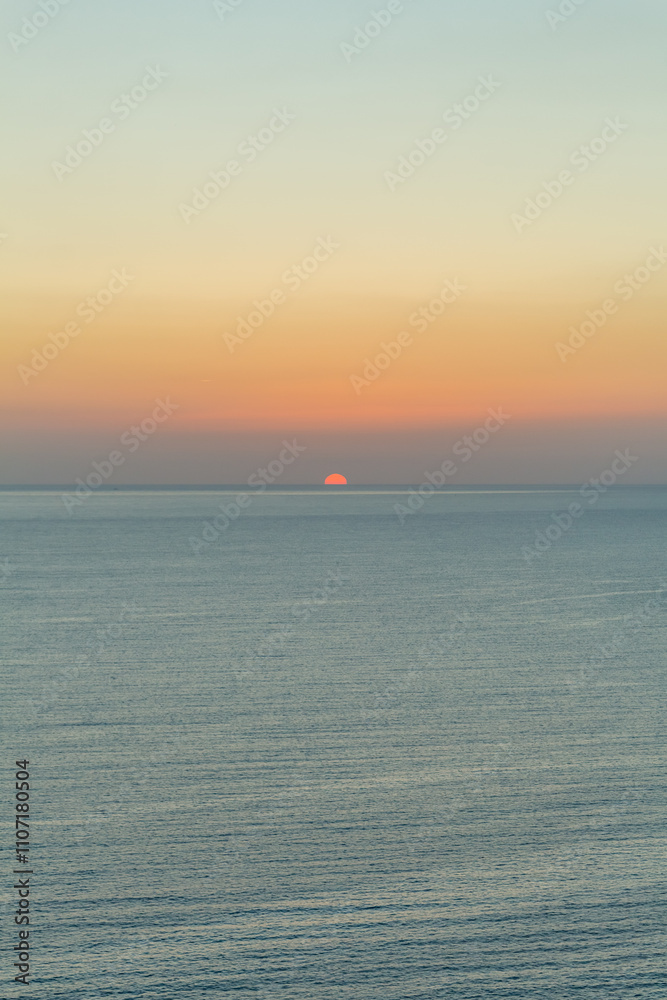 Sunset at Zapallo Bay: Twilight with Sun Setting Behind Mountain Sunset at Zapallo Bay: Twilight with Sun Setting Behind Mountain
