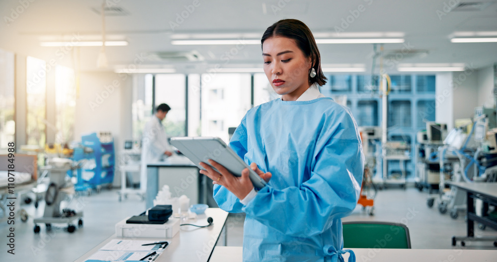Man, scientist and serious on tablet at laboratory for medical research, investigation or results on vaccine tests in Japan. Female person, healthcare professional and innovation on drug trial report Man, scientist and serious on tablet at laboratory for medical research, investigation or results on vaccine tests in Japan. Female person, healthcare professional and innovation on drug trial report