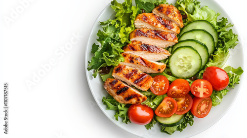 Grilled chicken salad with mixed greens, cucumber, and cherry tomatoes on white plate, offering light and refreshing meal option