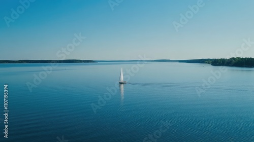 Panoramic Aerial View of White Sailboat Gliding on Calm Lake with Clear Blue Sky, Beautiful Landscape, Forest in Distance, Serene Summer Scene, Natural Scenery, Tranquil Mood, Daylight-Lit Setting.