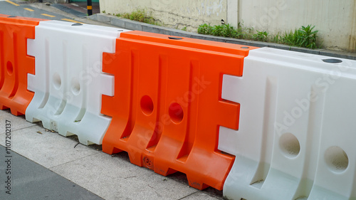 traffic barricade plastic blocks on the roadside photo