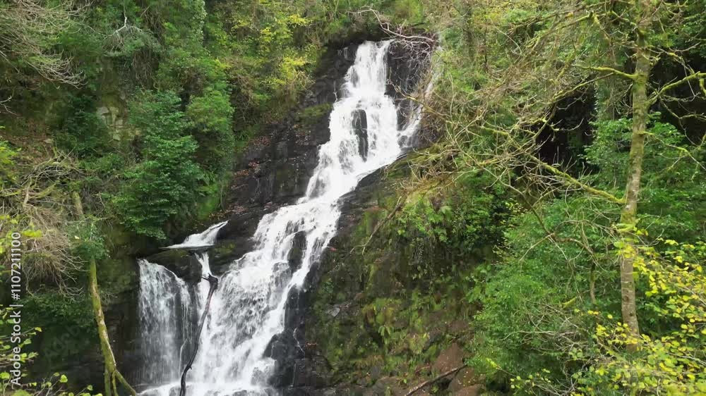 Stream of water cascading in the forest, Torc waterfall drone aerial landing. Autumn in Ireland Stream of water cascading in the forest, Torc waterfall drone aerial landing. Autumn in Ireland