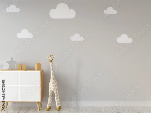 A minimalist nursery with a giraffe toy and cloud wall decals photo