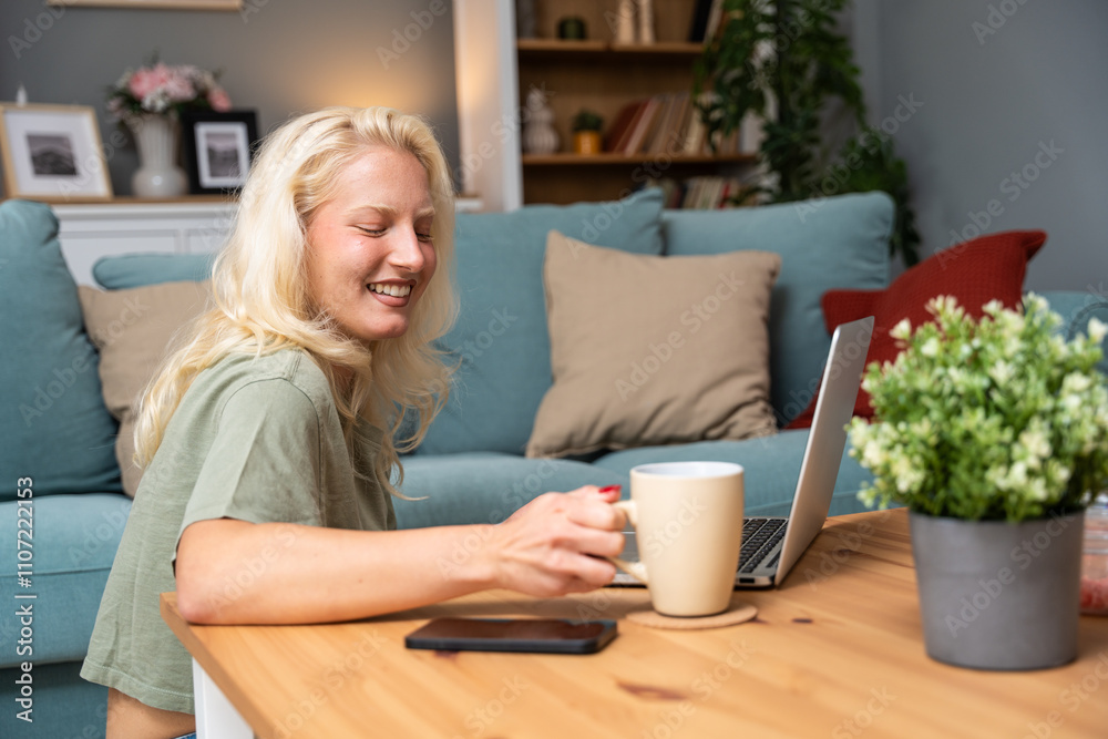 Smiling young woman using laptop sitting on couch at home, beautiful girl shopping or chatting online in social network, having fun watching movie, freelancer working on computer project online dating Smiling young woman using laptop sitting on couch at home, beautiful girl shopping or chatting online in social network, having fun watching movie, freelancer working on computer project online dating