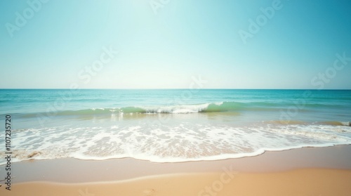 Serene Beach with Glowing Waves at Sunset