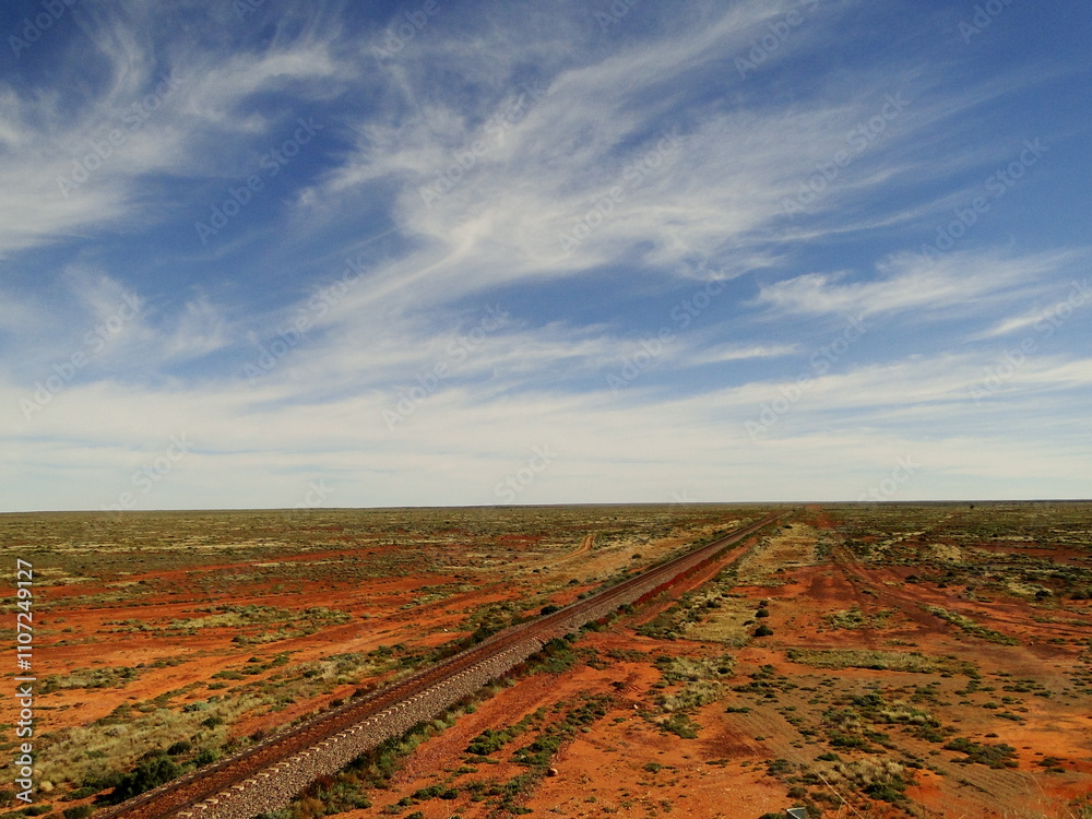 Naklejka premium Australian Landscape with a road in the Outback and Red Centre