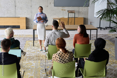 A businesswoman leader guiding a meeting with her colleagues, discussing business challenges, marketing strategies, and new plans for growth and success photo