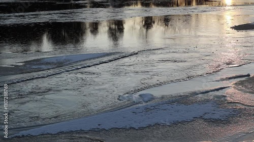 Kiiminkijoki river freezing over in Haukipudas, Oulu Finland photo