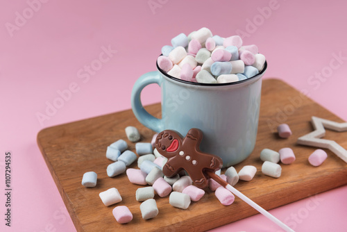 Marshmallow cup with chocolate man, sweet Christmas cookies