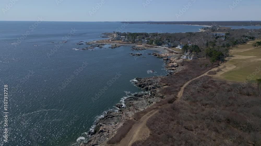 Aerial establishing overview of New Hampshire’s coastline featuring rugged rocky beaches and shrubbery by the shore Aerial establishing overview of New Hampshire’s coastline featuring rugged rocky beaches and shrubbery by the shore