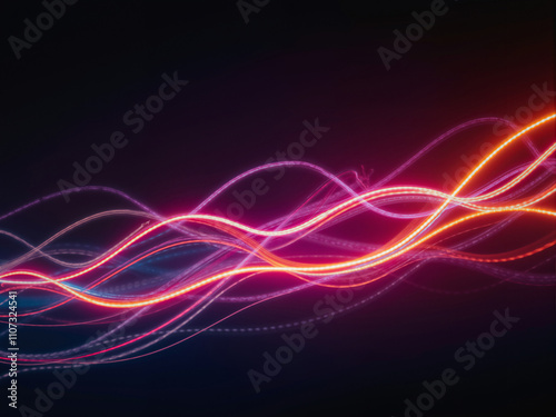 Abstract light trails flowing smoothly in the dark