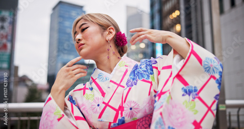Japanese woman, artist and dance with kimono in city for hand movement, contemporary style and expression. Creative culture, performer and nihon buyo with traditional fashion, urban town or heritage photo