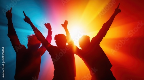 A trio of dancers joyfully gesturing with arms up, silhouetted against blue and orange bursts of color, capturing the emotional release in passionate dancing. photo