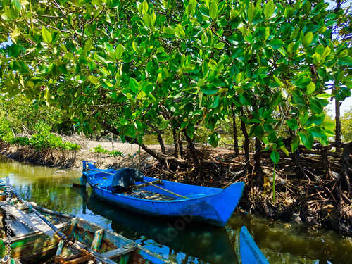 an old traditional Indonesian fishing boat that still uses wood photo