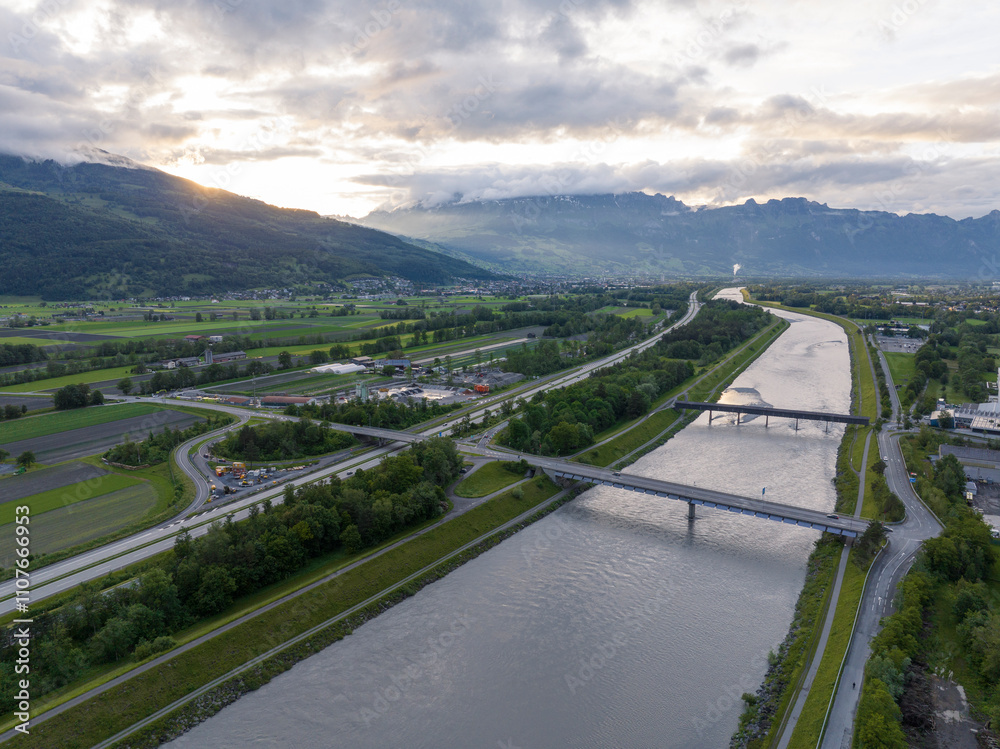 Rhine River on a border of Switzerland and Liechtenstein. Aerial View in evening. Tiny European Country Liechtenstein.