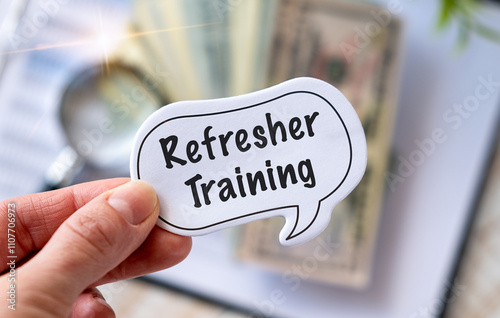 фотографія Refresher Training text on paper in hand. Business Education
