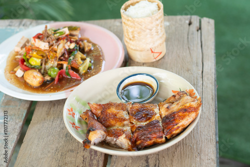 Grilled chicken, papaya salad, and sticky rice. Thai food
