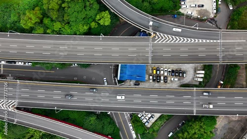 Aerial View of Layered Highways with Adjacent Parking Lot