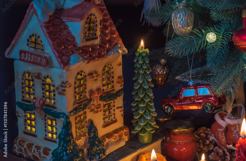 Fototapeta premium Winter holiday concept. Inspiration and fairy time with a candles, Christmas tree at holydays. Magical time