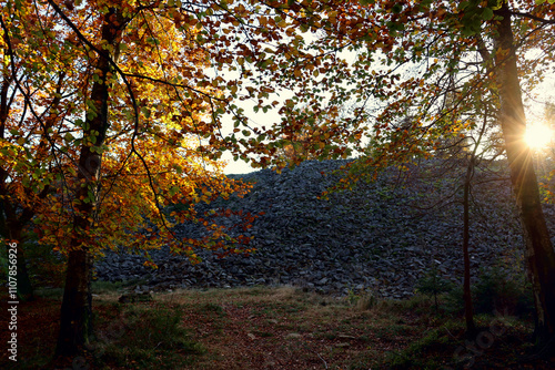 Sonnenuntergang  am keltischen Ringwall Hunnenring im Herbst im Nationalpark Hunsrück-Hochwald bei Otzenhausen. Aussicht von den Wanderwegen Traumschleife Dollbergschleife und Saar-Hunsrück-Steig. photo