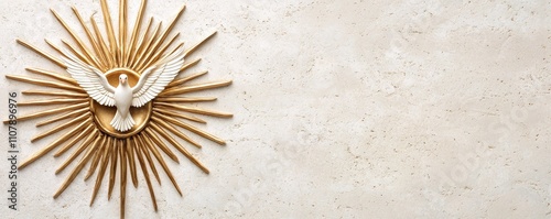 A golden dove is framed by radiating rays against a textured wall, symbolizing peace and spirituality. photo