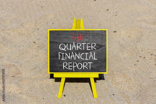 4th quarter financial report symbol. Concept words 4th quarter financial report on beautiful black blackboard. Beautiful sand background. Business 4th quarter financial report concept. Copy space. photo