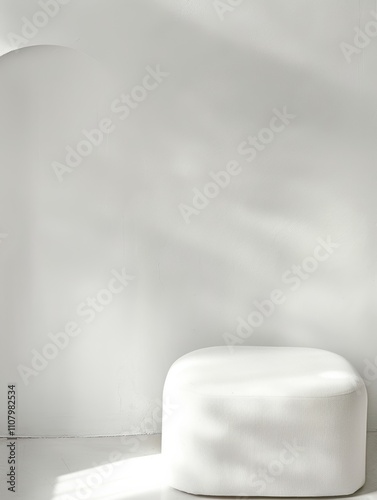 Minimalist Interior Scene: A soft white seating piece with gentle shadows, ideal for modern design inspirations.