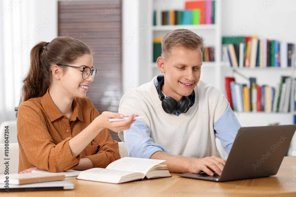 Fototapeta premium Students preparing for exam at table indoors