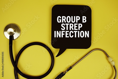 Group B Strep Infection text on speech bubble with stethoscope on yellow background, Healthy concept photo