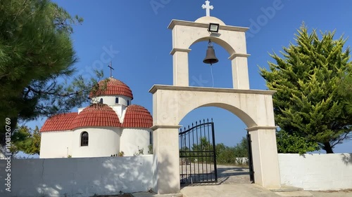 Cathedral on the rock. Orthodox church on top of a mountain, on the shores of the Aegean Sea in Greece. The church is white on a sunny day. High quality 4k footage