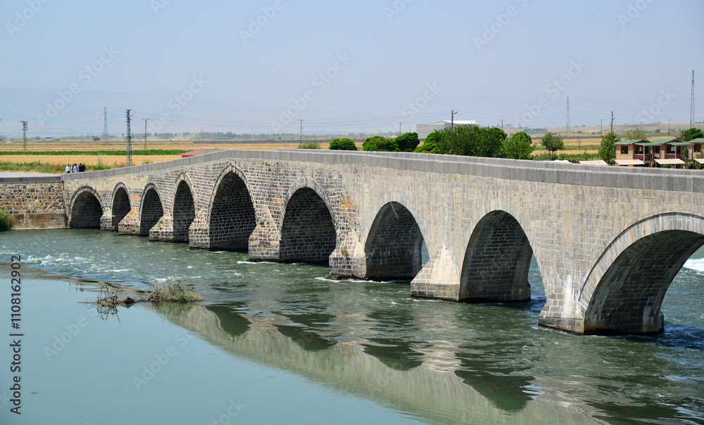 Fototapeta premium The Historical Murat Bridge, located in Mus, Turkey, was built during the Seljuk period in the 13th century.