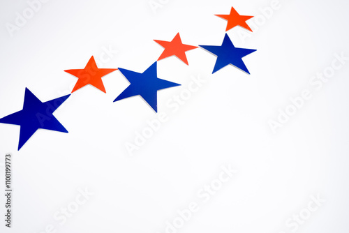 Red blue stars decor on light background. Copy space, minimalist style, festive background for design