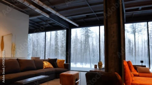 A modern industrial living room with a steel-framed fireplace and loft-style open space. 