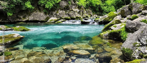 Fototapeta Naklejka Na Ścianę i Meble -  Rocky riverbank with fast-moving water and moss-covered stones, , water, wild flowage, rocks, natural scenery