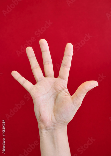 Open hand gesture with red background