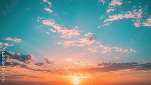 Bright sunset sky transitioning to twilight with light clouds