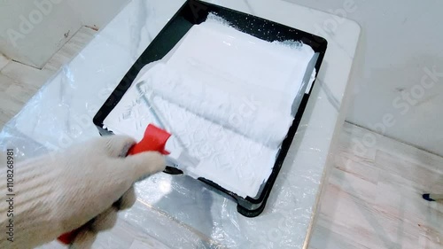 paint roller on wall