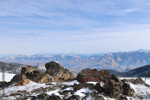 photo from snowy ridge in the Seven Devils Mountains near Riggins ID looking across the Salmon River Canyon at the rugged mountains in the background
