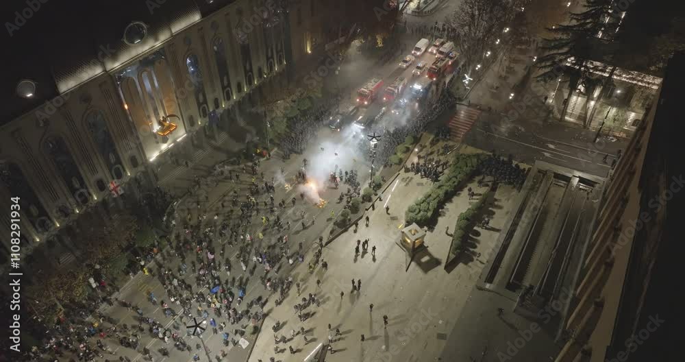 Thousands of protesters in the streets of Tbilisi to protest against the government's decision to suspend accession talks with the European Union. Protesters clash with Georgian police. Aerial protest